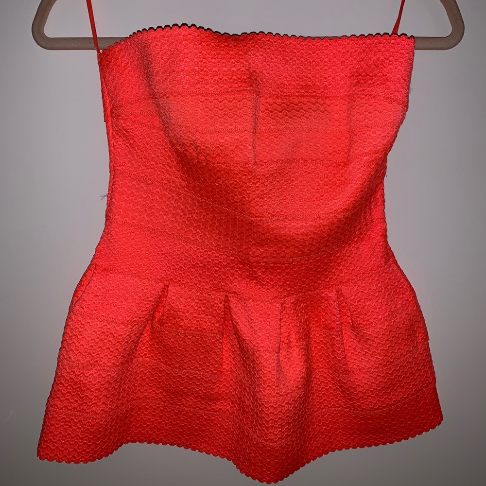 Sleeveless coral peplum top
